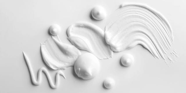 White cream spread and spread on a white background