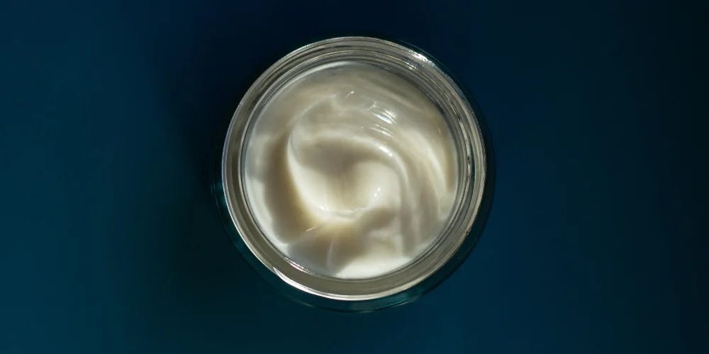 An open jar of Nudmuses night cream